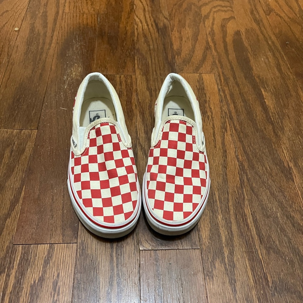 Red and White checkered Vans.